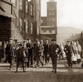 Workers leaving the mill