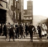 Workers leaving the mill